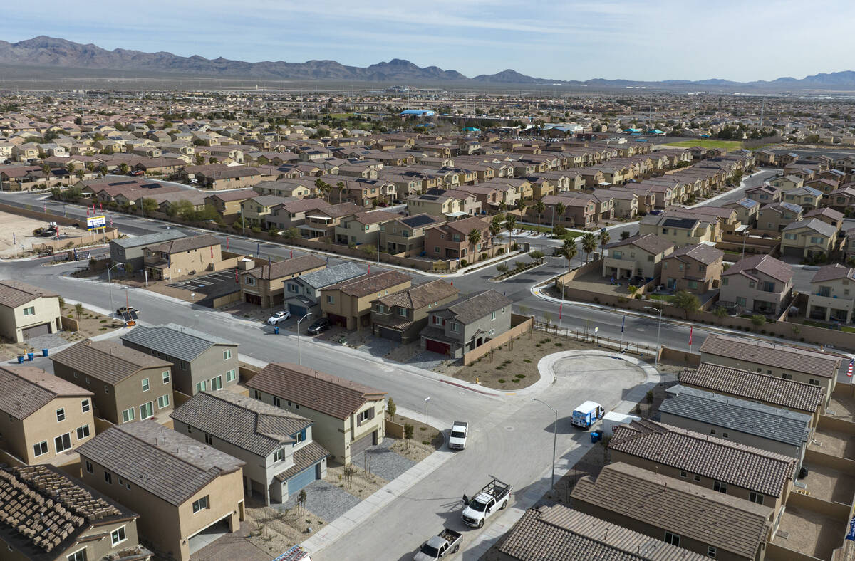 A new housing development, front, and existing community are seen at the corner of Ann Road and ...