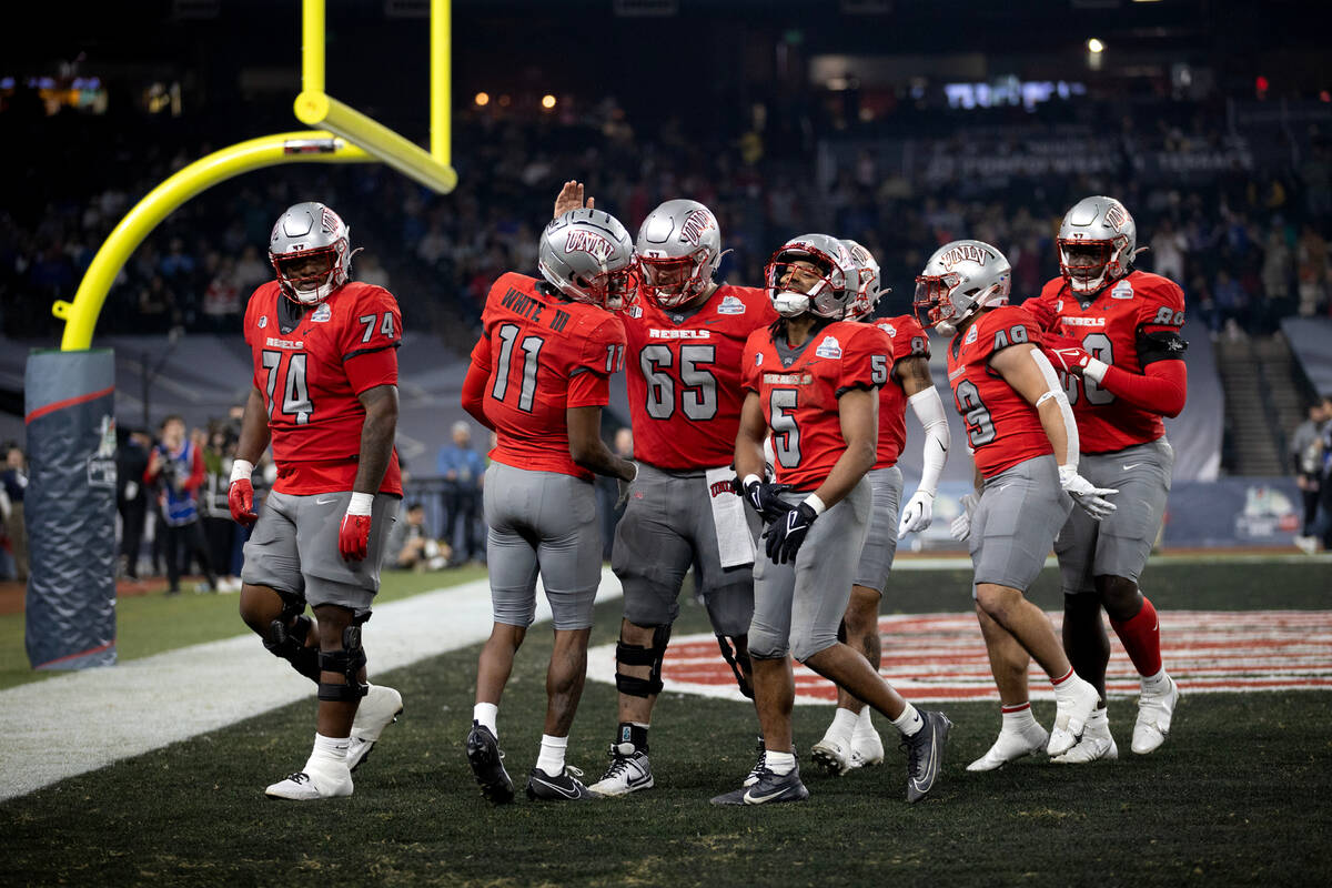 The UNLV Rebels celebrate a touchdown during the second half of the Guaranteed Rate Bowl NCAA c ...