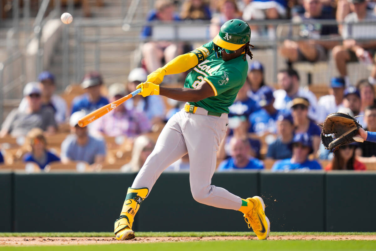 Oakland Athletics' Lawrence Butler lines out during the third inning of a spring training baseb ...