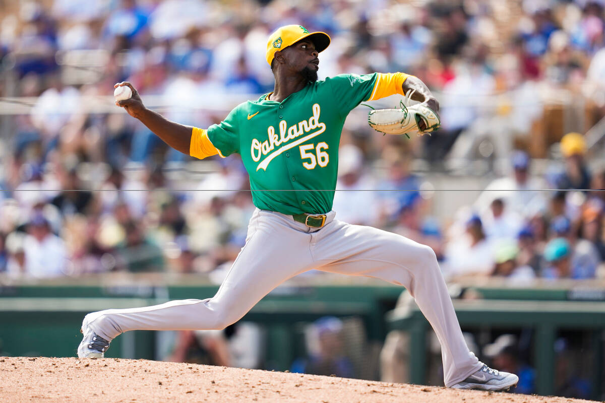 Oakland Athletics relief pitcher Dany Jimenez throws during the third inning of a spring traini ...