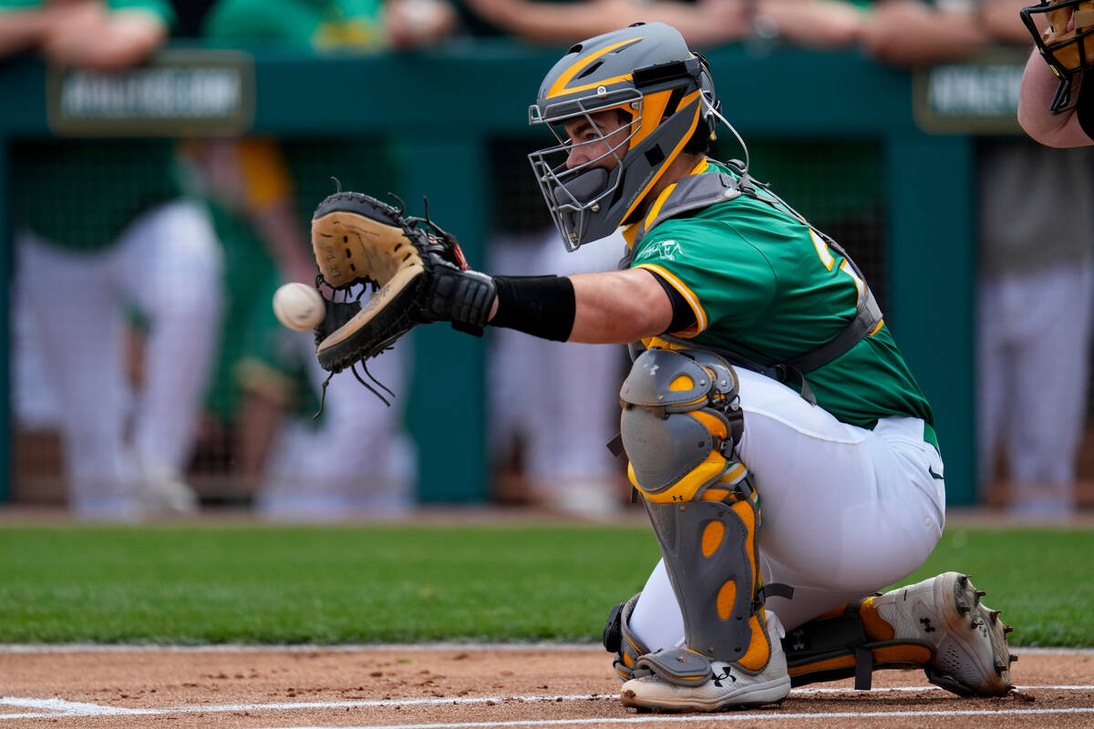 Oakland Athletics' Shea Langeliers catches during the first inning of a spring training basebal ...