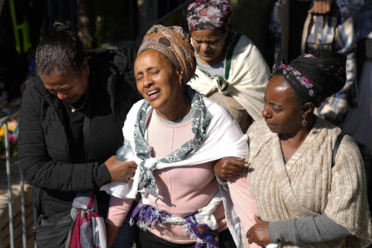 Bat Sheva, center, mother of Israeli solider Staff sergeant Narya Belete, mourns in grief durin ...