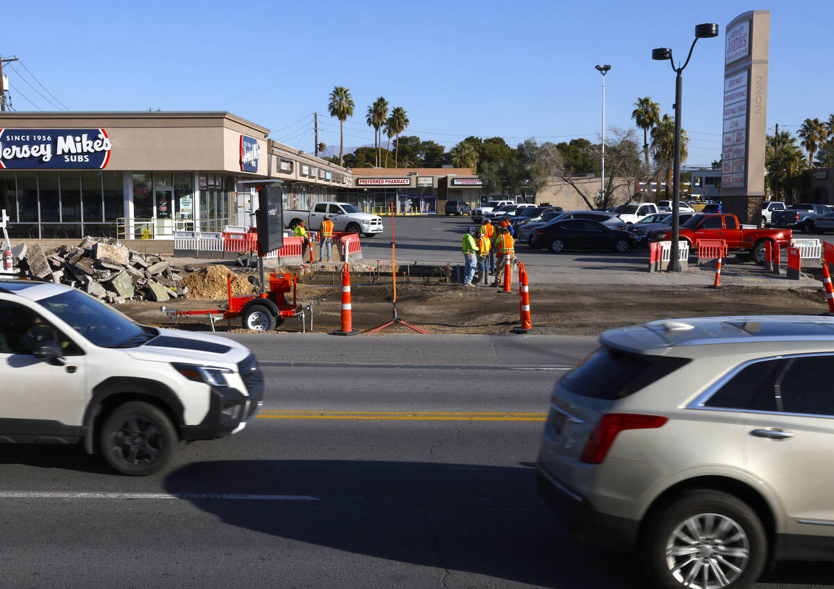 Road construction is underway near a shopping plaza at Charleston Boulevard and Rancho Drive in ...