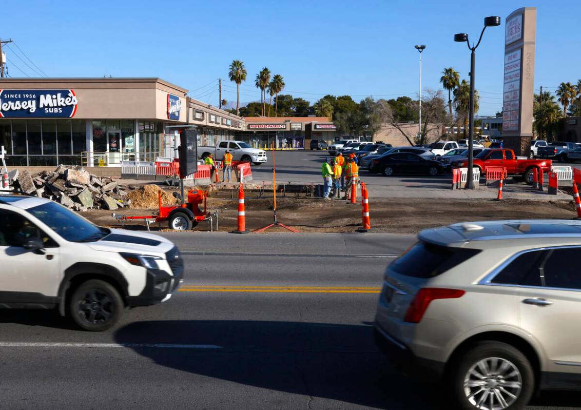 Road construction is underway near a shopping plaza at Charleston Boulevard and Rancho Drive in ...