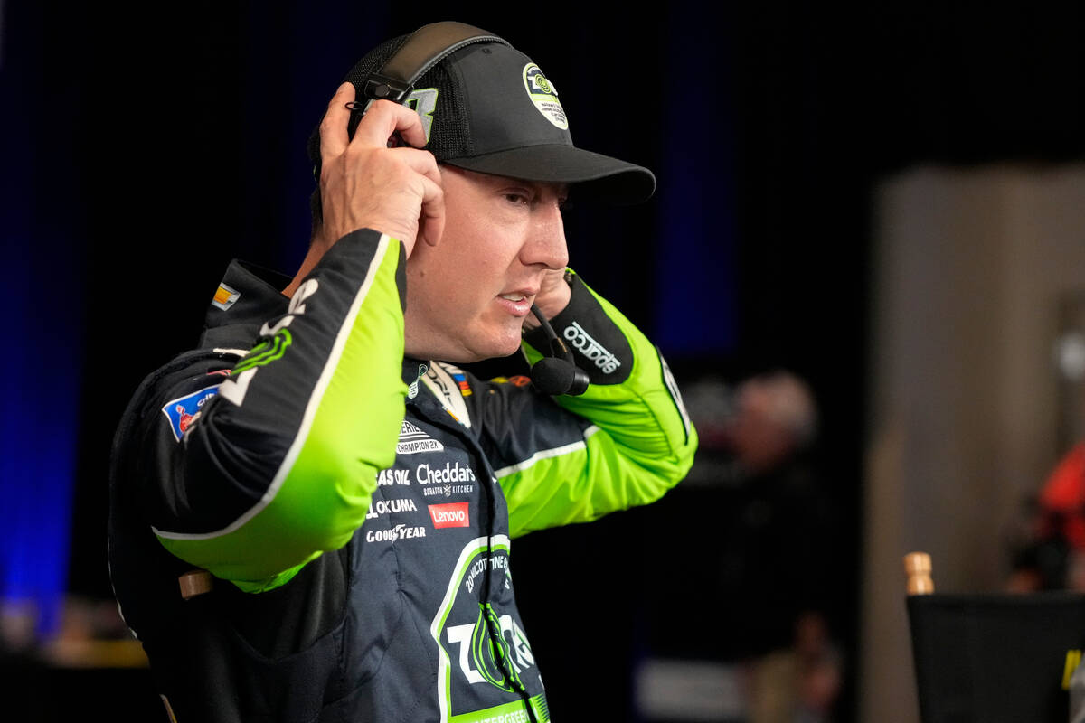 Kyle Busch removes his headphones at the end of an interview during NASCAR Daytona 500 auto rac ...