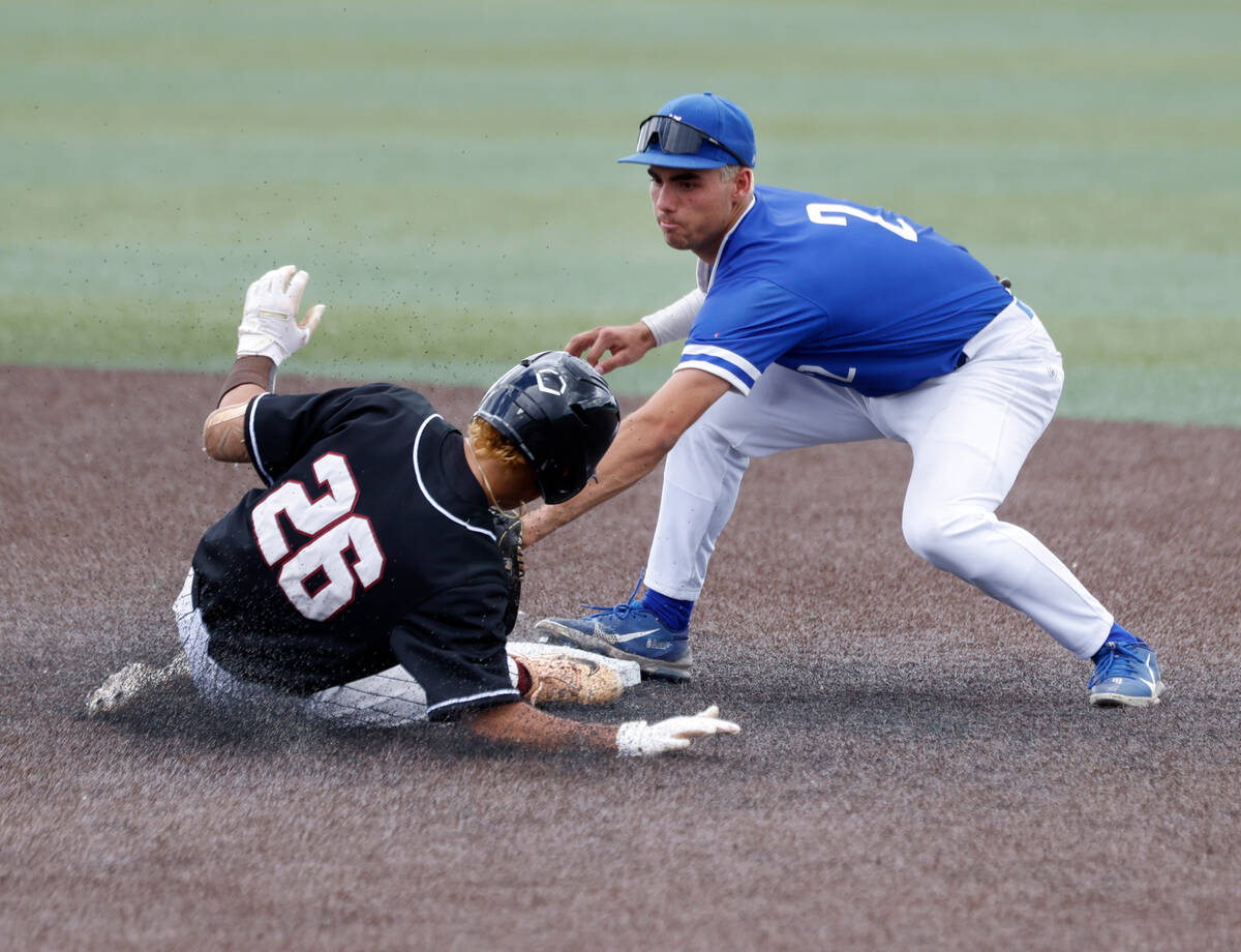 Bishop Gorman's second baseman Maddox Riske (2) tags out a sliding Desert Oasis' Porter Brunn d ...