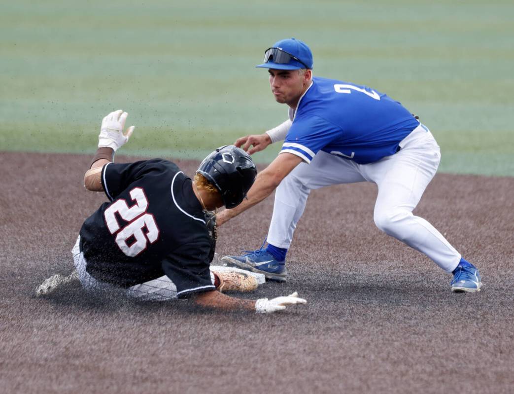 Bishop Gorman's second baseman Maddox Riske (2) tags out a sliding Desert Oasis' Porter Brunn d ...