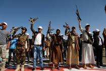 Newly recruited Houthi fighters attend a protest march against the U.S.-led strikes on Yemen an ...