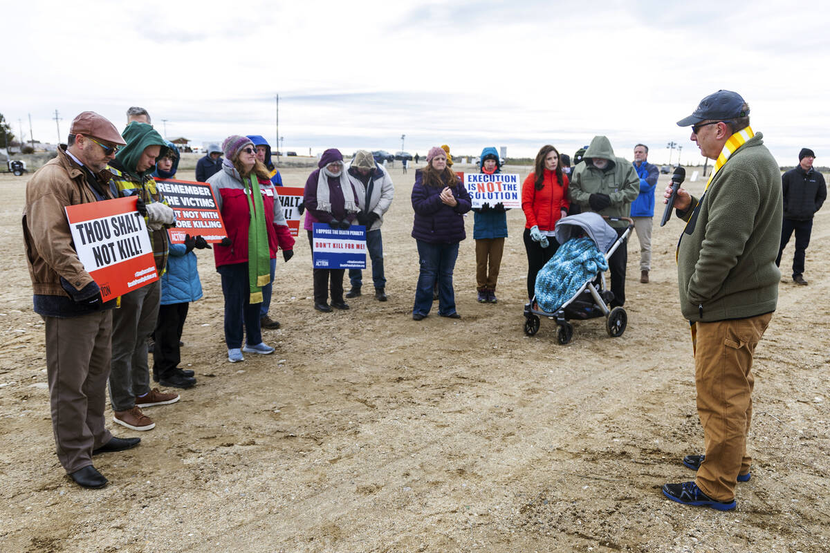 Rev. Mike Hollomon of Caldwell United Methodist and Emmett United Methodist prays with proteste ...