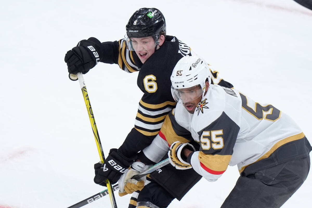 Boston Bruins defenseman Mason Lohrei (6) and Vegas Golden Knights right wing Keegan Kolesar (5 ...