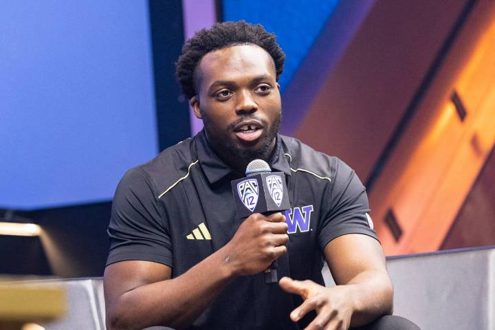 Washington Huskies linebacker Edefuan Ulofoshio speaks during the Pac-12 Football media day at ...