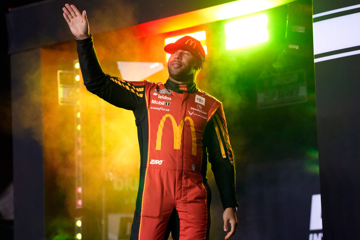 Bubba Wallace waves to fans during driver introductions before Daytona 500 qualifying auto race ...