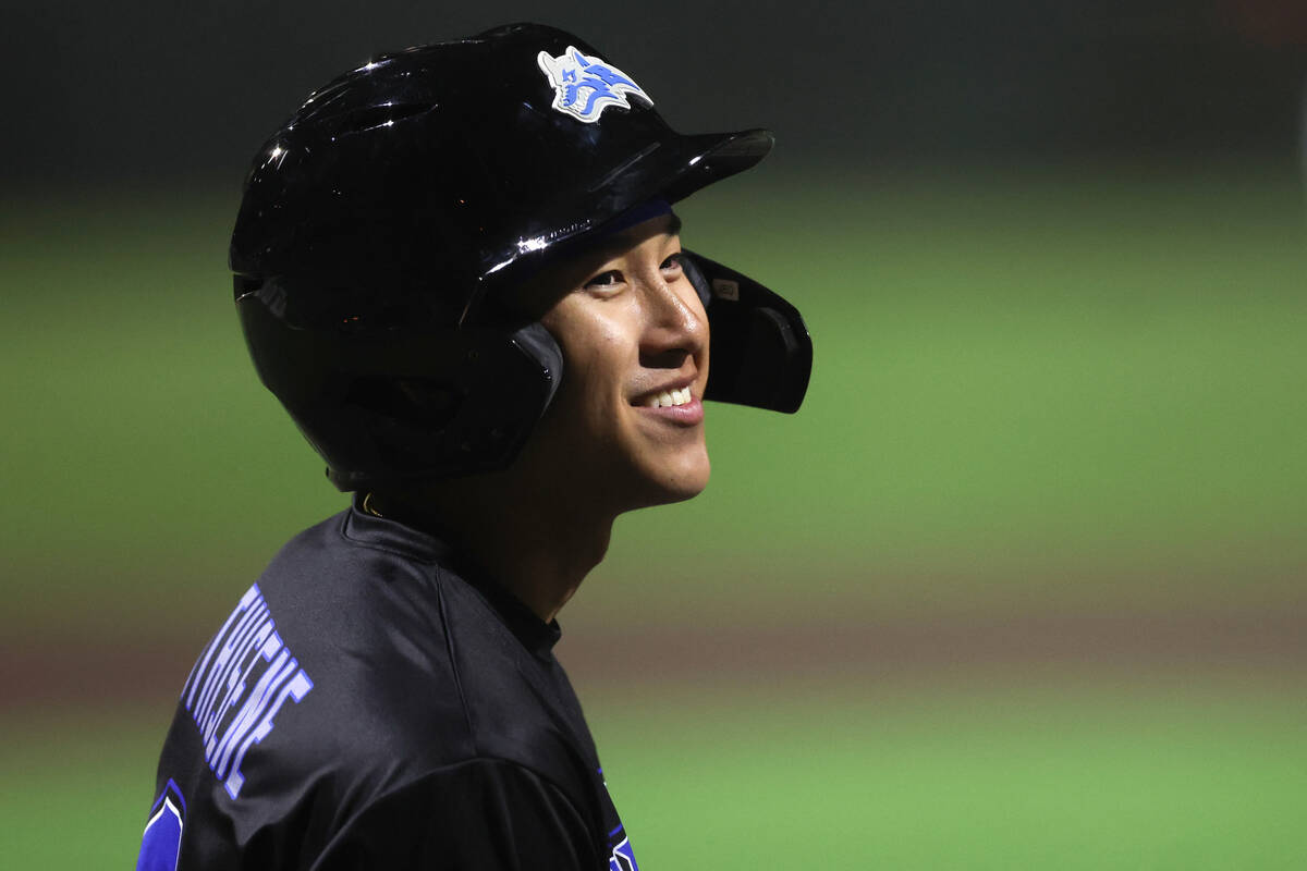 Basic’s Ty Southisene smiles before batting against Bishop Gorman during a high school b ...