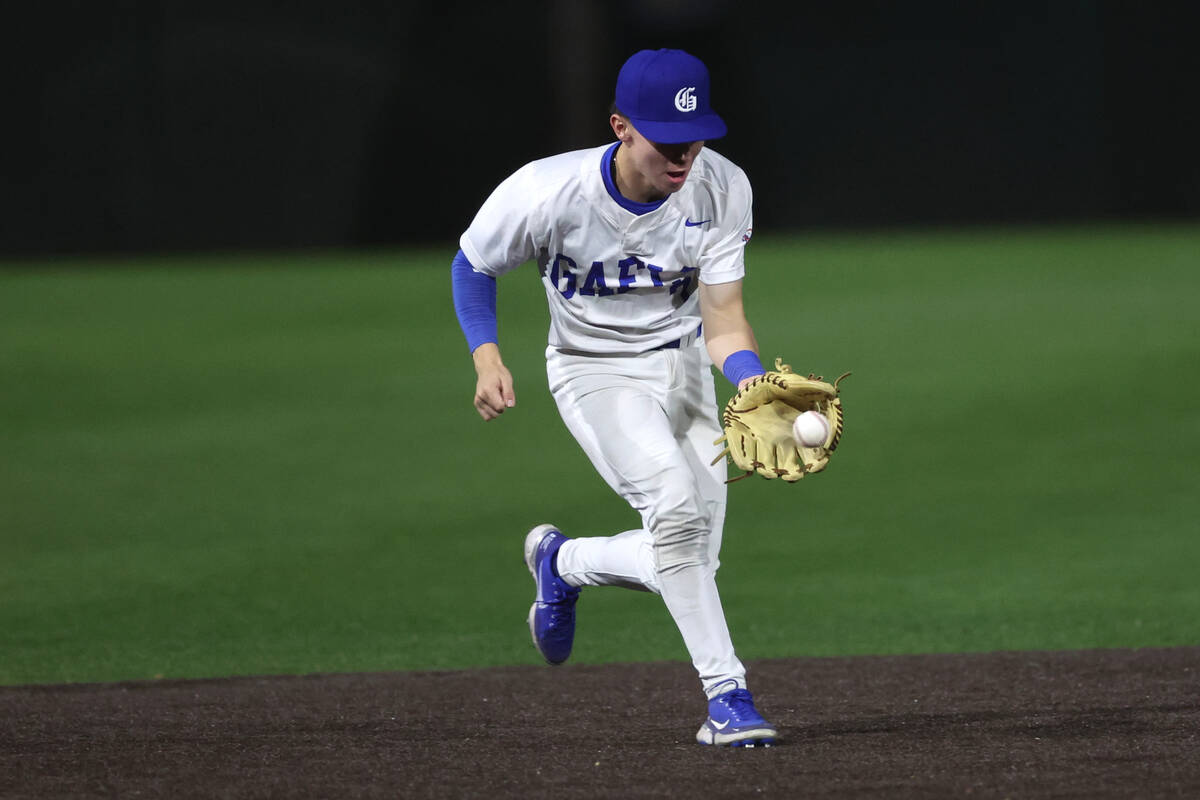 Bishop Gorman short stop Colton Boardman catches for an out over Basic during a high school bas ...