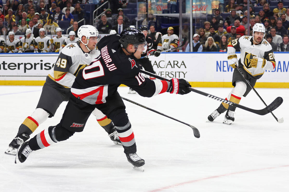 Buffalo Sabres defenseman Henri Jokiharju (10) shoots on goal during the first period of an NHL ...