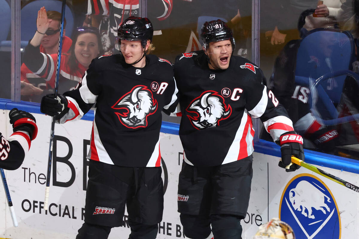 Buffalo Sabres right wing Kyle Okposo (21) celebrates his goal with defenseman Rasmus Dahlin (2 ...