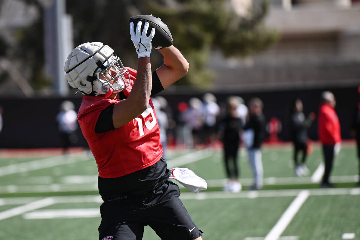 UNLV tight end Kaleo Ballungay pulls in a pass during the first day of spring practice Saturday ...