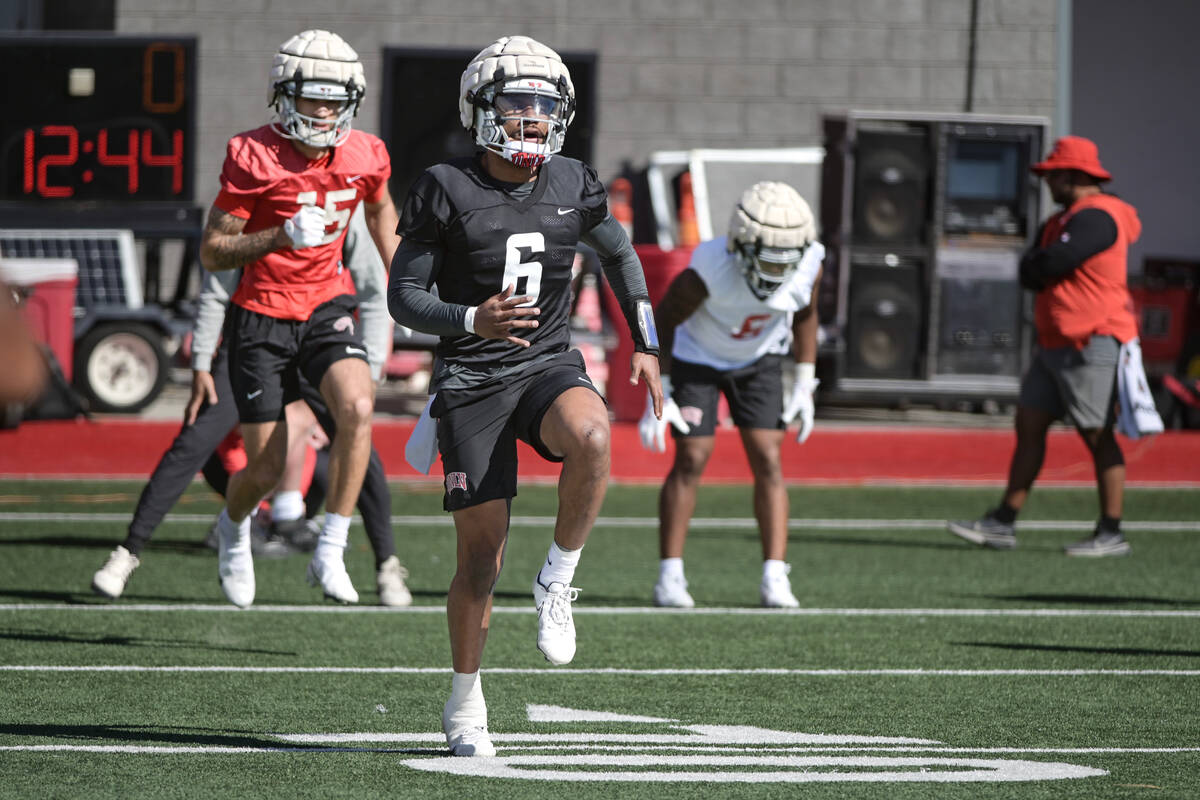 UNLV quarterback Hajj-Malik Williams warms up during the first day of spring practice Saturday, ...