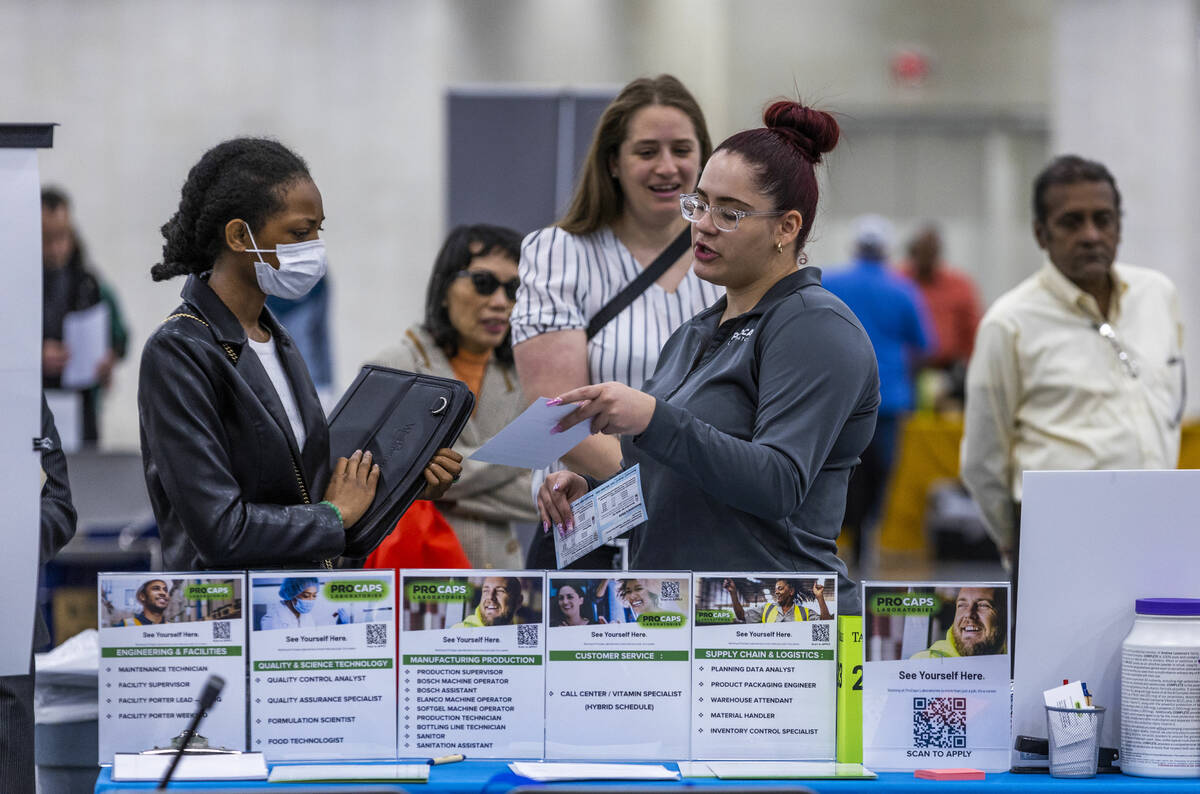 Procaps Laboratories staff talk with job seekers as more than 100 employers at the annual Sprin ...