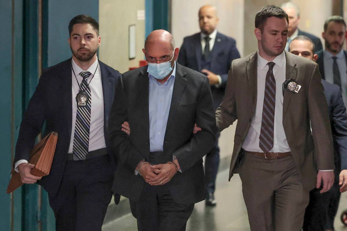 Allen Weisselberg, center, is escorted to Manhattan criminal court, Monday, March 4, 2024, in N ...