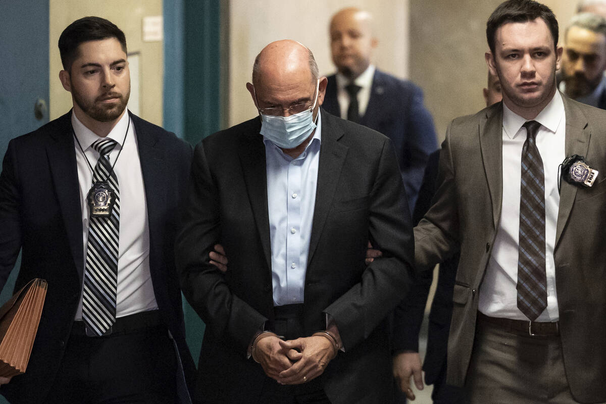 Allen Weisselberg, center, is escorted to Manhattan criminal court, Monday, March 4, 2024, in N ...