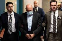 Allen Weisselberg, center, is escorted to Manhattan criminal court, Monday, March 4, 2024, in N ...