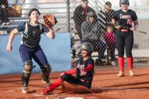 Liberty High School’s Jaydah Chun (50) slides over home base against Foothill High School dur ...