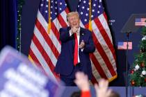 Former President and 2024 presidential hopeful Donald Trump gestures at the end of a campaign e ...