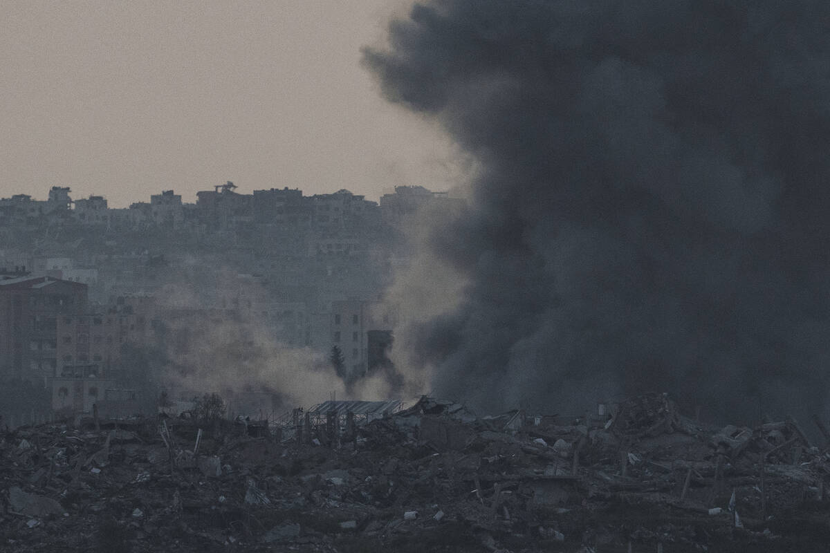 Smoke rises following an explosion in the Gaza Strip, as seen from southern Israel, Tuesday, Ma ...