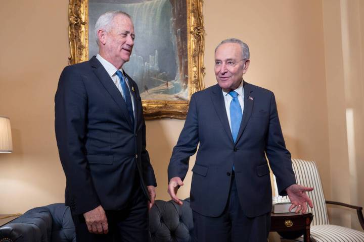 Benny Gantz, left, a key member of Israel's War Cabinet and the top political rival of Israeli ...