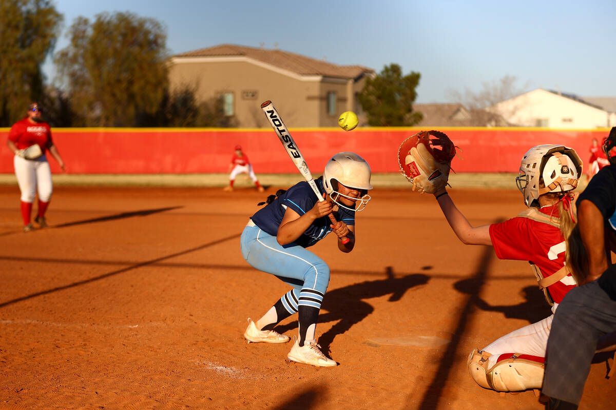 Centennial's Leeah Ibarra (6) ducks to avoid an Arbor View pitch during a high school softball ...