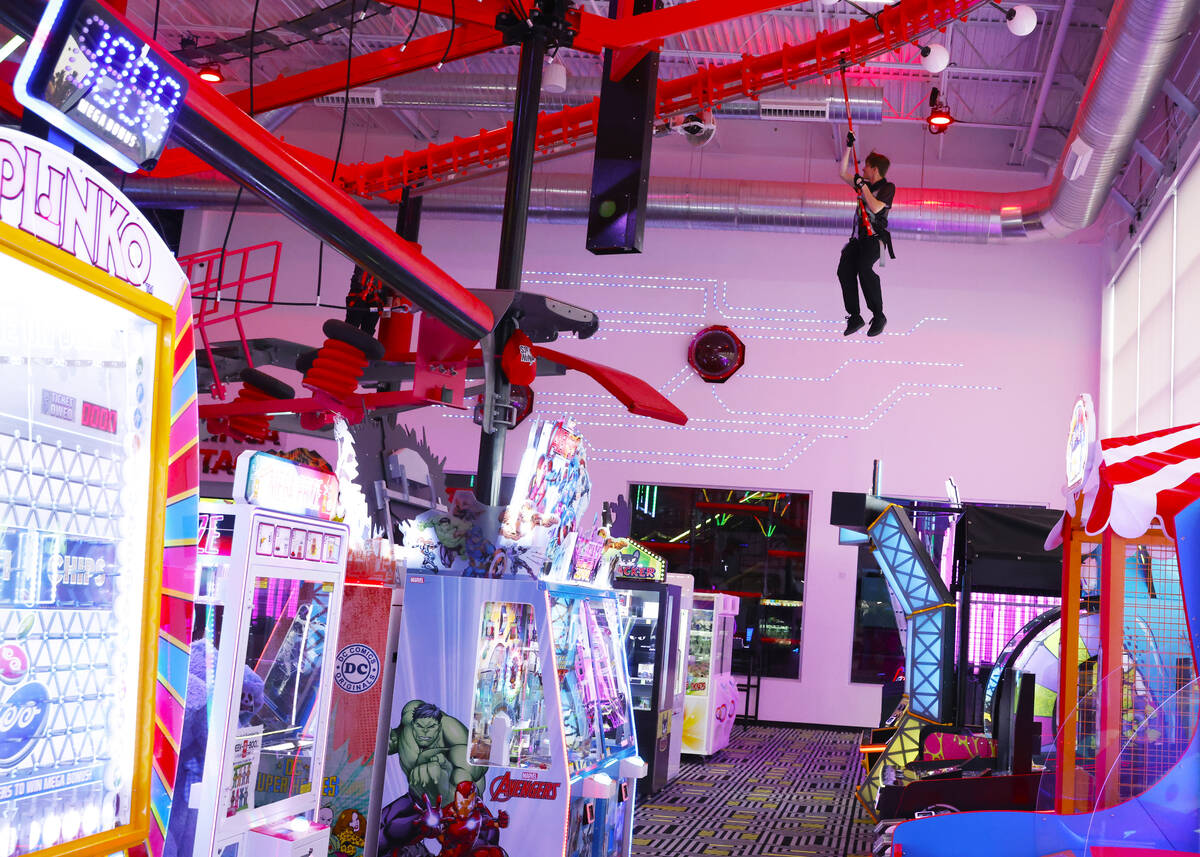 An employee inspects a sky rail at Spy Ninja HQ, the World's First YouTuber Theme Park, on Thur ...