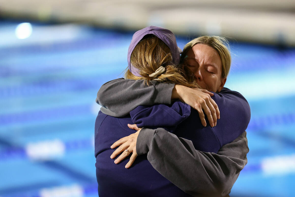 Anna Clark, right, mother of Charlie Clark, embraces a community member during a vigil for the ...