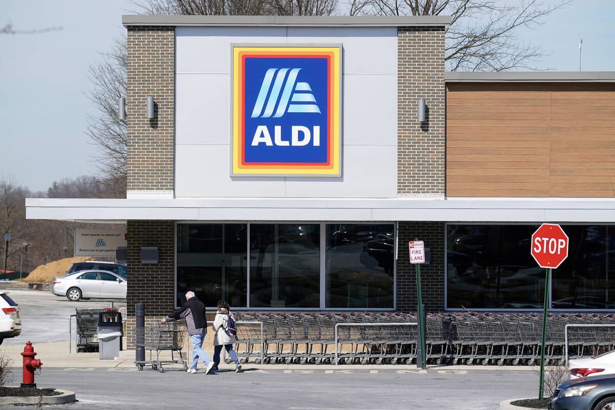 Customers walk into an Aldi supermarket in Bensalem, Pa., March 14, 2022. Discount grocer Aldi ...