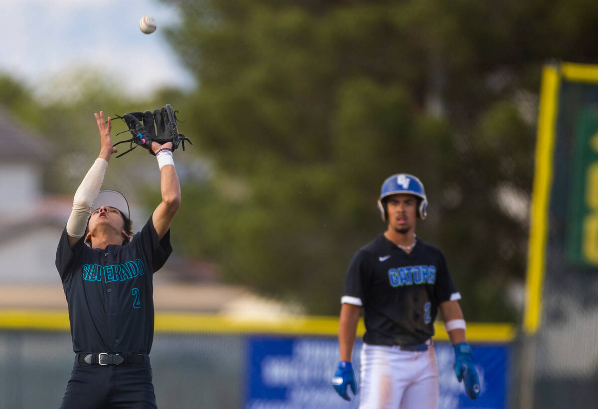 Silverado infielder Adam Rhodus (2) looks in a fly ball against Green Valley during their NIAA ...