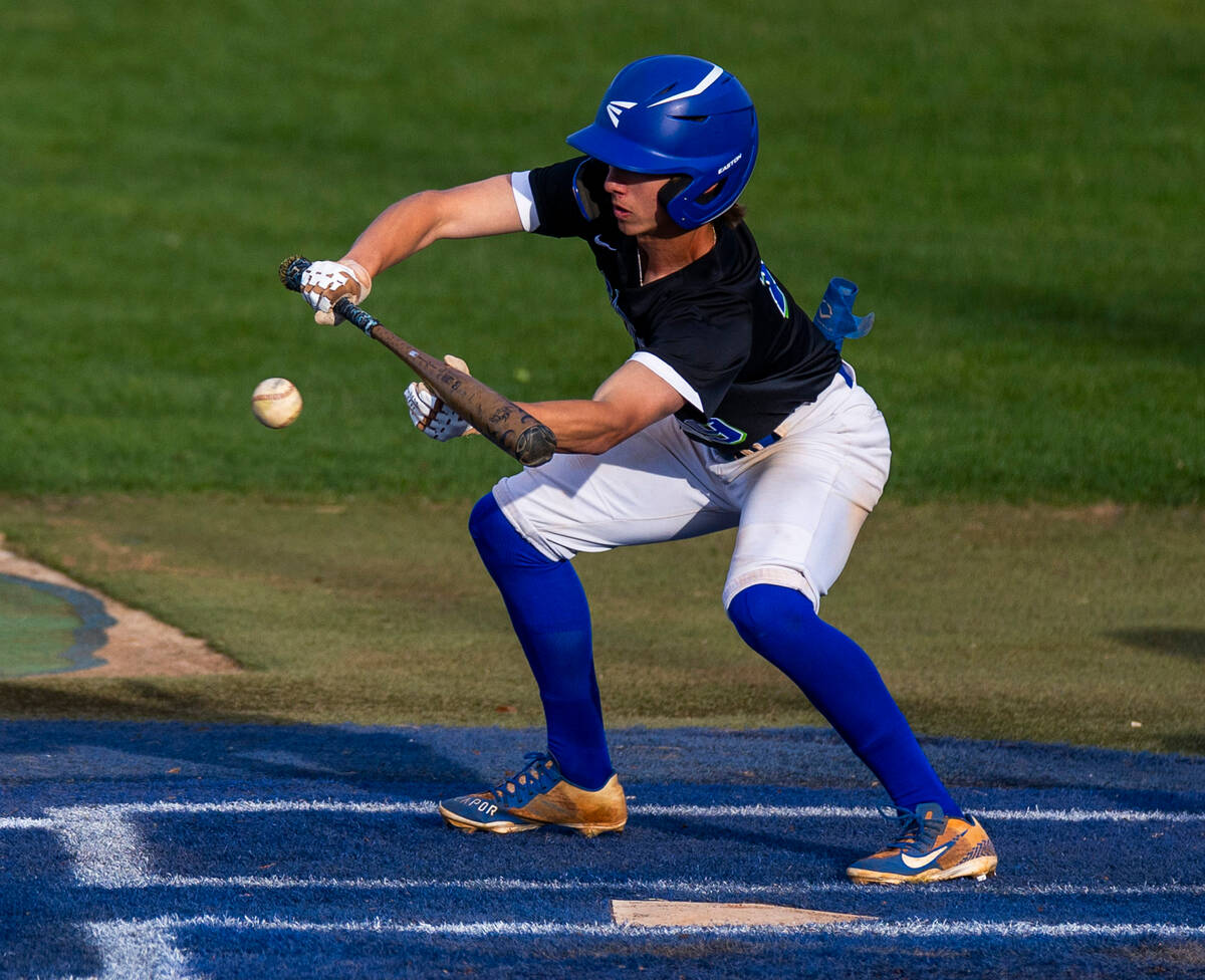 Green Valley batter Benjamin Byington (19) bunts a Silverado pitch during their NIAA baseball g ...