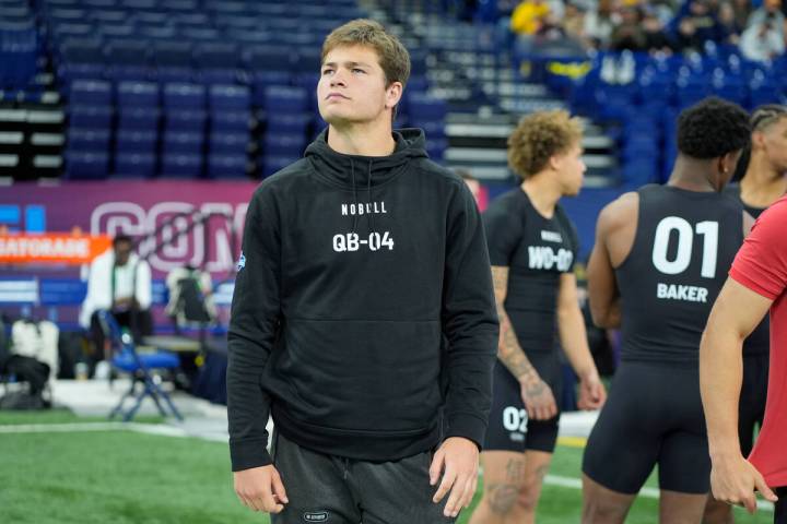 North Carolina quarterback Drake Maye arrives on the field before the workout at the NFL footba ...