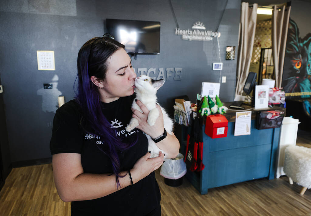 Brittany Rutledge, feline program coordinator, holds Pippa at Hearts Alive Village Cat Cafe, wh ...