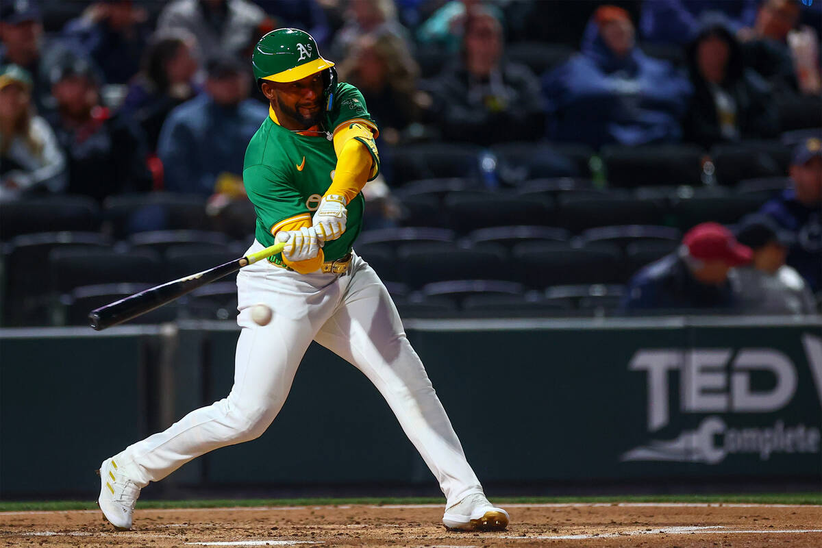 Oakland Athletics outfielder Miguel Andujar (22) bats during a Major League Baseball spring tra ...