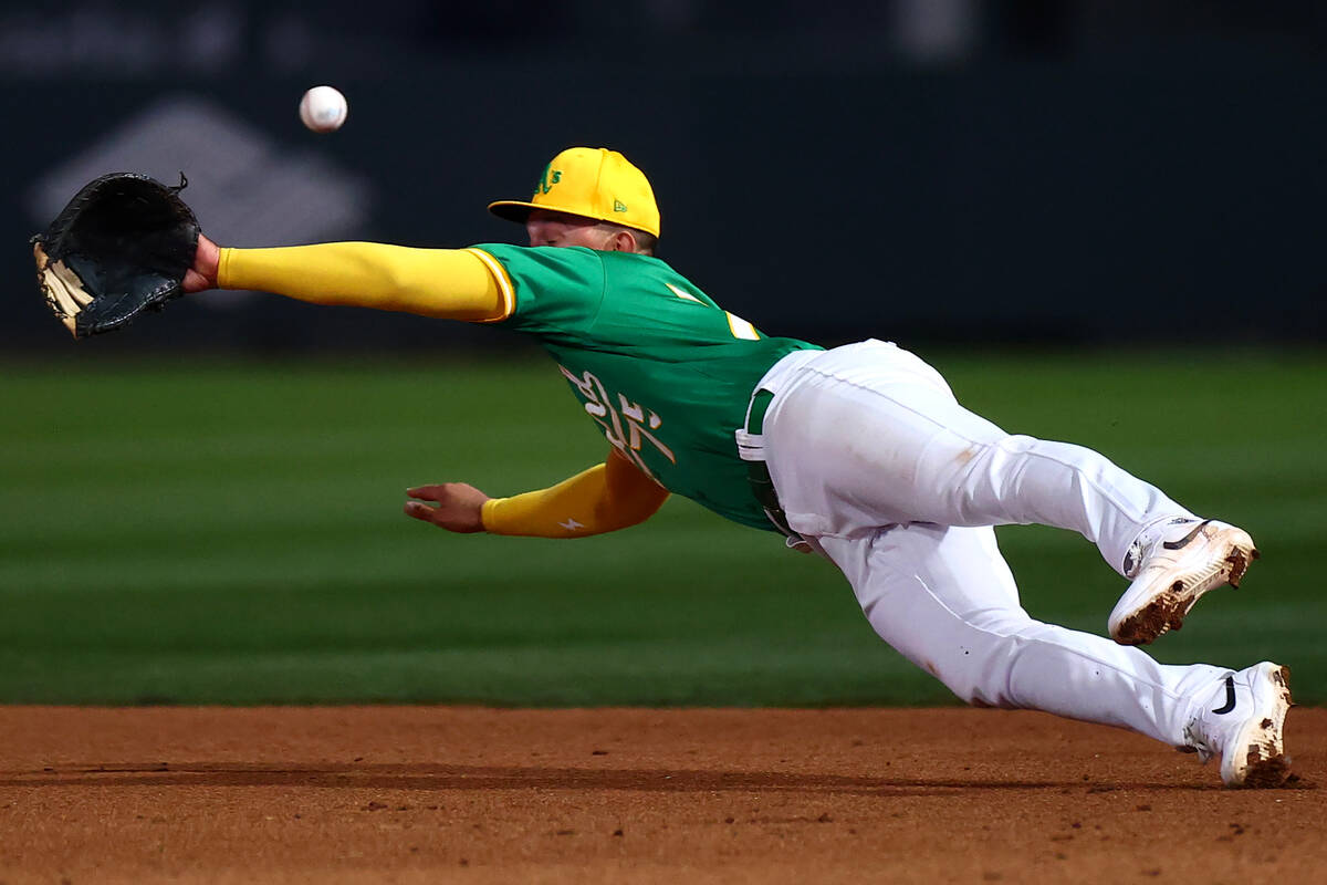 Oakland Athletics first baseman Drew Lugbauer (75) misses a catch during a Major League Basebal ...