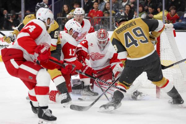 Golden Knights center Ivan Barbashev (49) attempts to score on Red Wings goaltender James Reime ...
