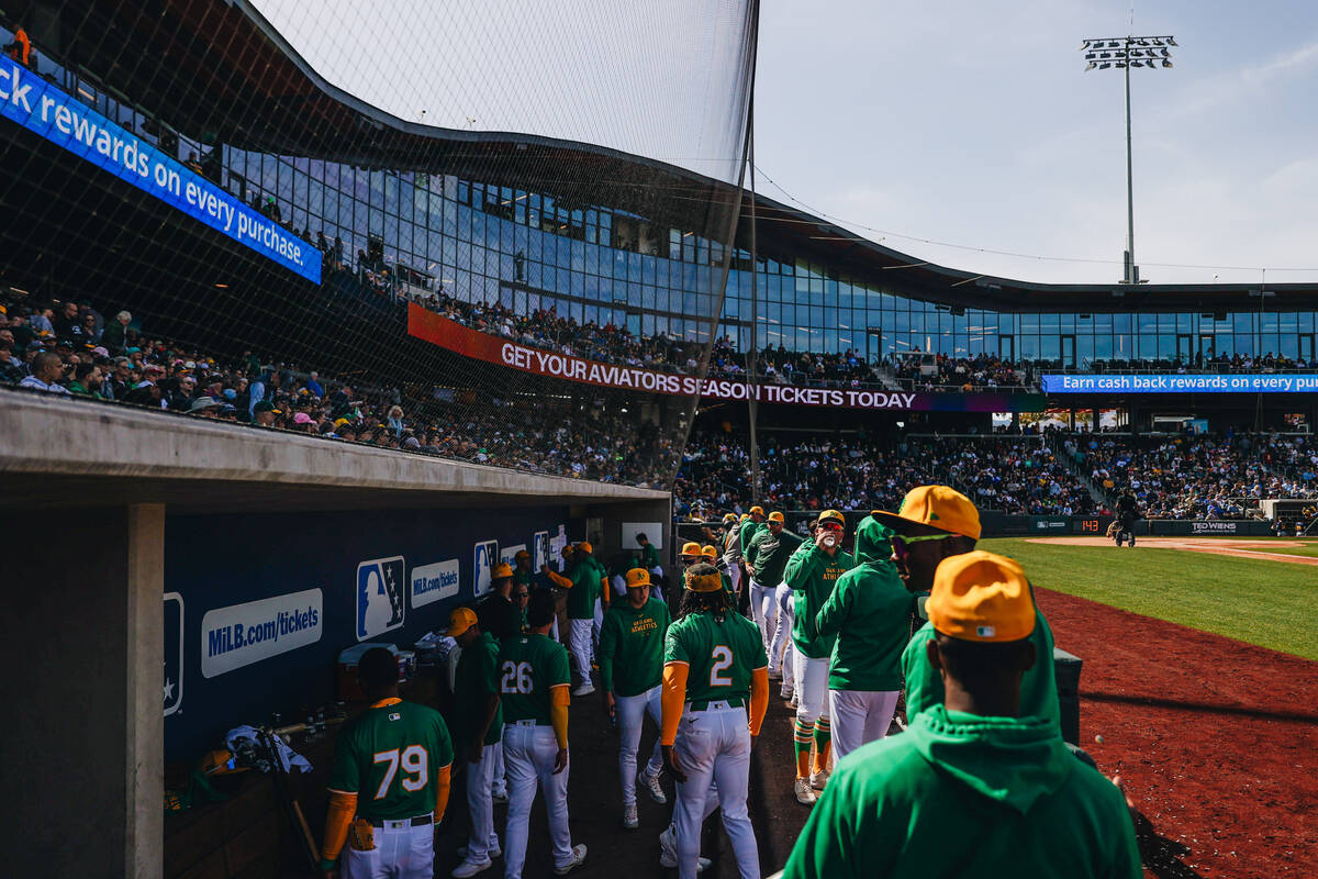 Oakland A’s players hang out in the dug out during a Big League Weekend game between the ...