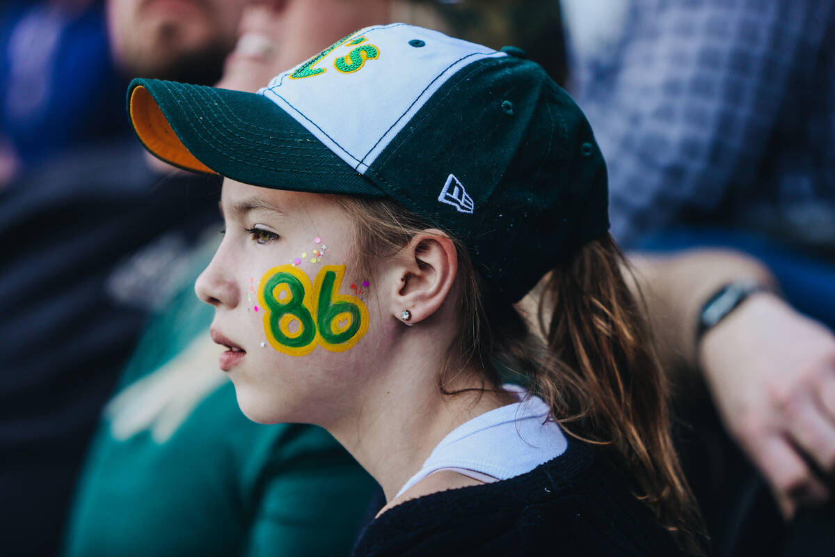 An Oakland A’s fan watches her team during a Big League Weekend game between the Oakland ...