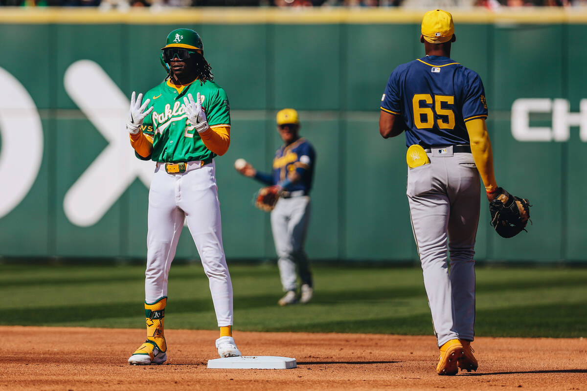 Oakland A’s outfielder Lawrence Butler (2) poses after making it to second base during a ...