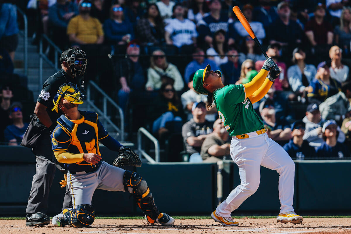 Oakland A’s catcher Yohel Pozo (32) watches a fly ball during a Big League Weekend game ...