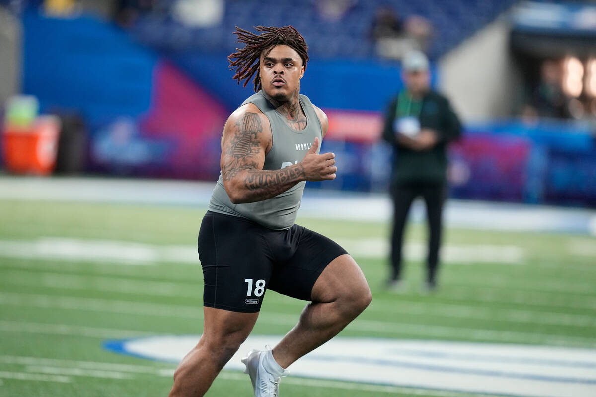 Texas defensive lineman Byron Murphy runs a drill at the NFL football scouting combine, Thursda ...