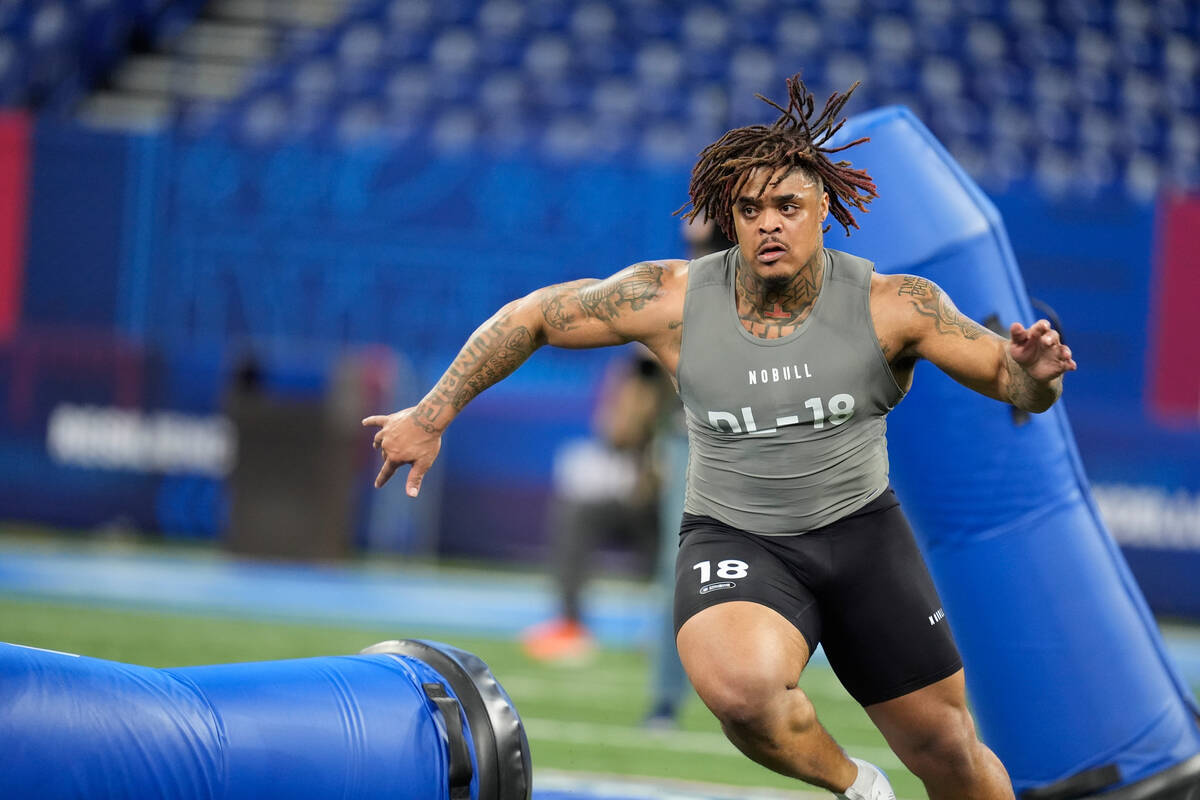 Texas defensive lineman Byron Murphy runs a drill at the NFL football scouting combine, Thursda ...