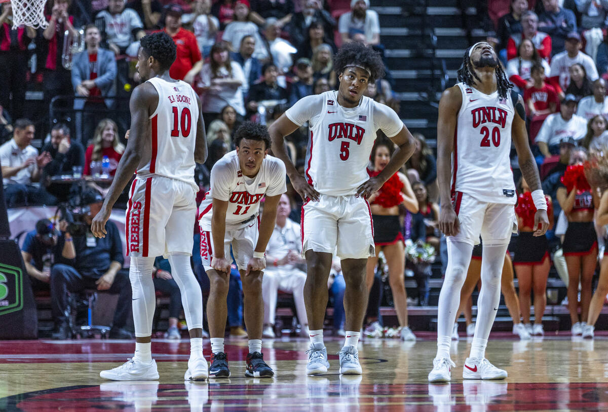 UNLV players are spent as the game nears an end against the San Diego State Aztecs during the s ...