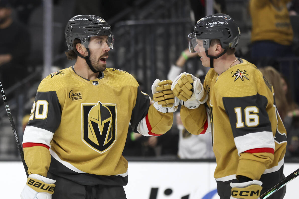 Golden Knights center Chandler Stephenson (20) and left wing Pavel Dorofeyev (16) celebrate Dor ...