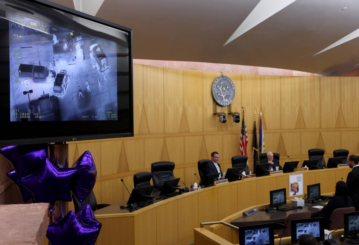 Police video is shown as Detective Jason Leavitt, left, testifies during a fact-finding review ...